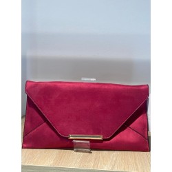 Cartera de mano rosa sobre