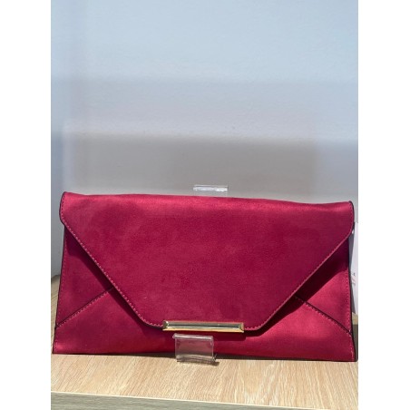 Cartera de mano rosa sobre